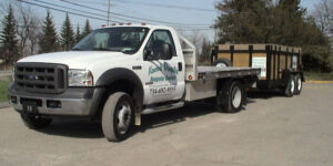 A dump truck is parked in the parking lot.